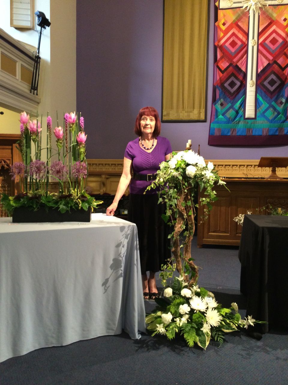 Jean McClure with 2 of her arrangements